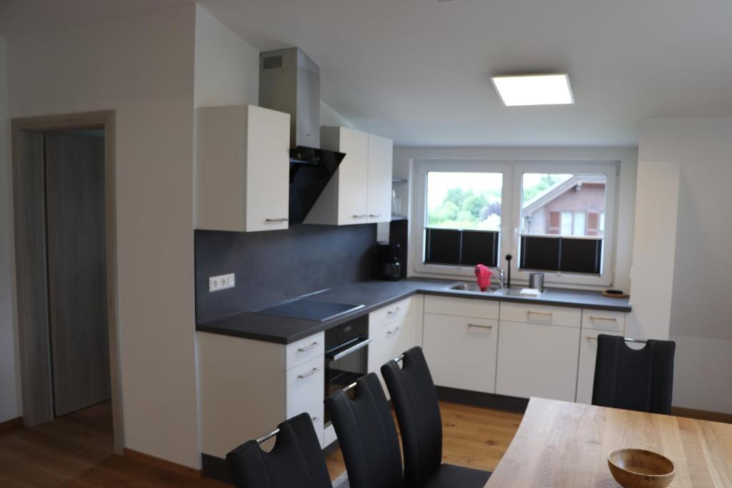 Kuchyň nebo kuchyňský kout v ubytování Apartment DreamView