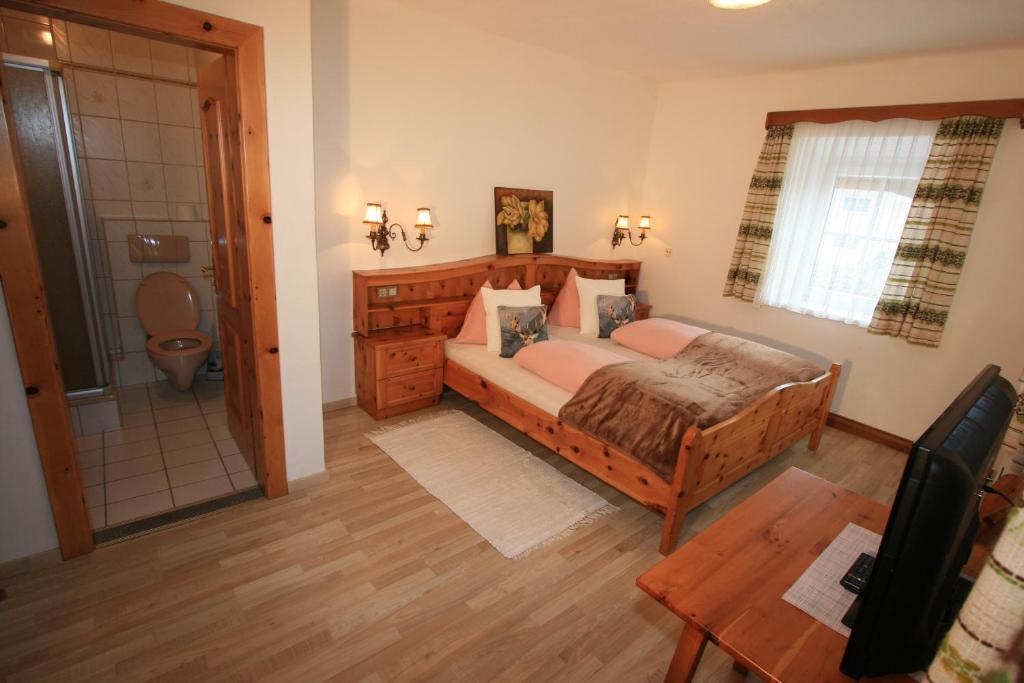Postel nebo postele na pokoji v ubytování Hotel Stadlwirt