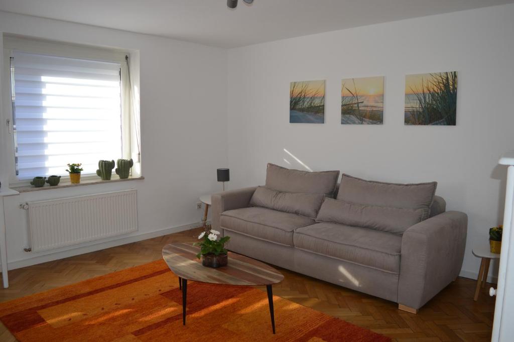 a living room with a couch and a table at Ludwig XIV in Saarlouis