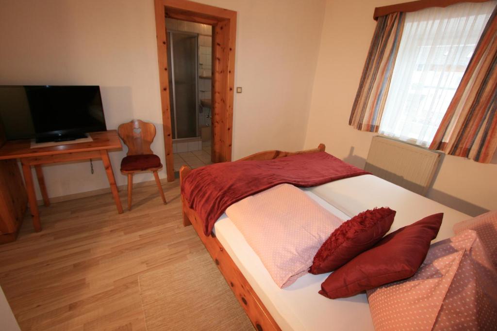 Postel nebo postele na pokoji v ubytování Hotel Stadlwirt