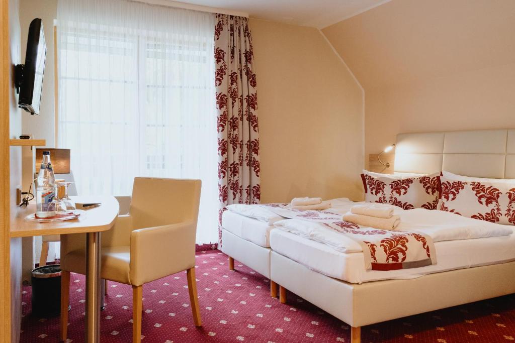 Postel nebo postele na pokoji v ubytování Hotel An den Bleichen