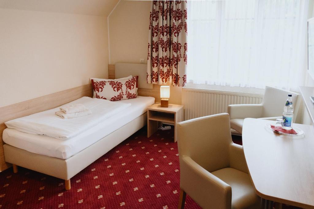Postel nebo postele na pokoji v ubytování Hotel An den Bleichen