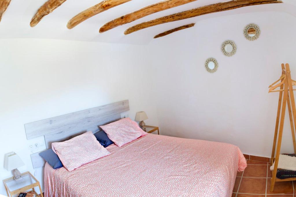 Postel nebo postele na pokoji v ubytování Casa del Arrabal