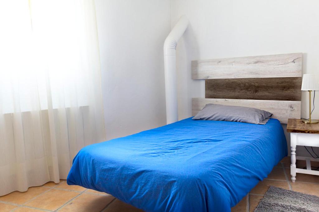 Postel nebo postele na pokoji v ubytování Casa del Arrabal
