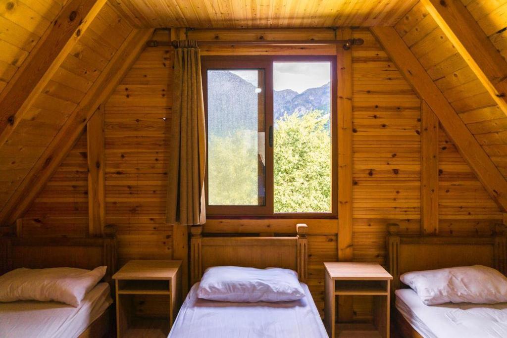 Postel nebo postele na pokoji v ubytování Bujtina Terthorja