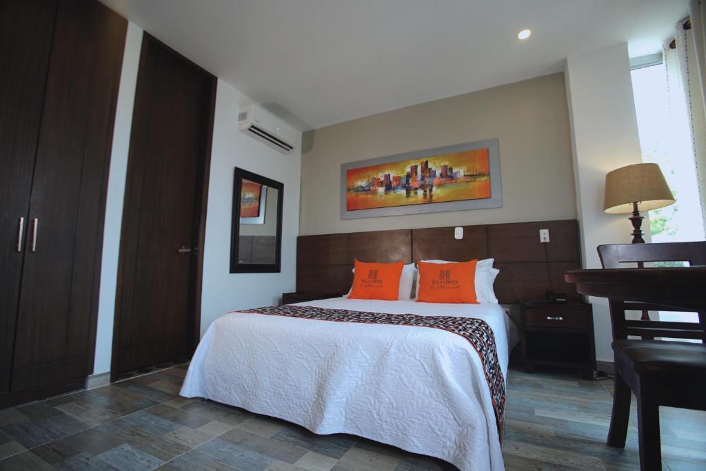 Postel nebo postele na pokoji v ubytování Hotel Ucla Center