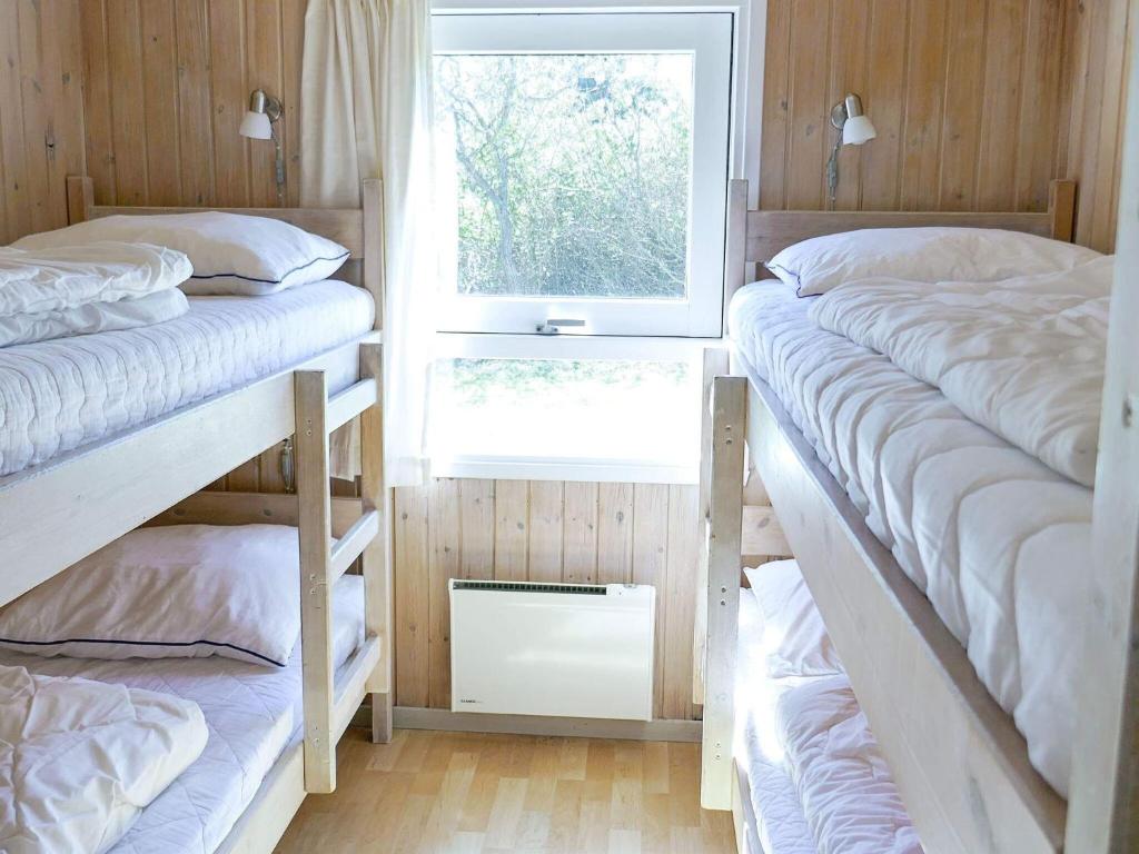 Postel nebo postele na pokoji v ubytování 10 person holiday home in Hjørring-By Traum