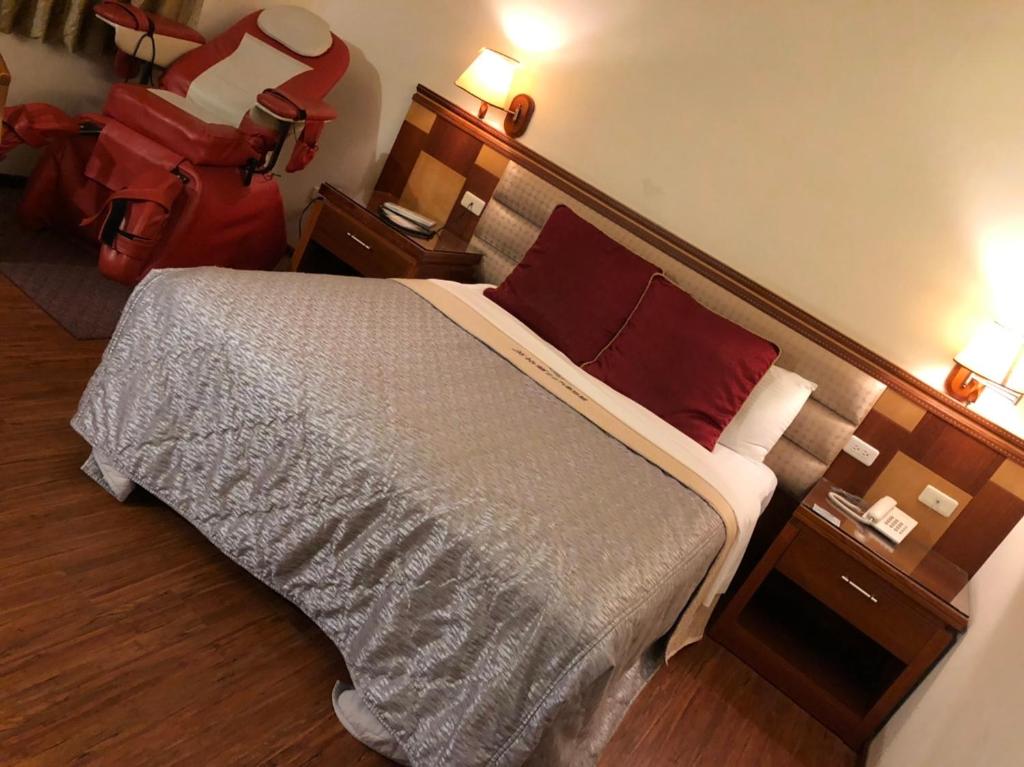 Postel nebo postele na pokoji v ubytování England Business Motel