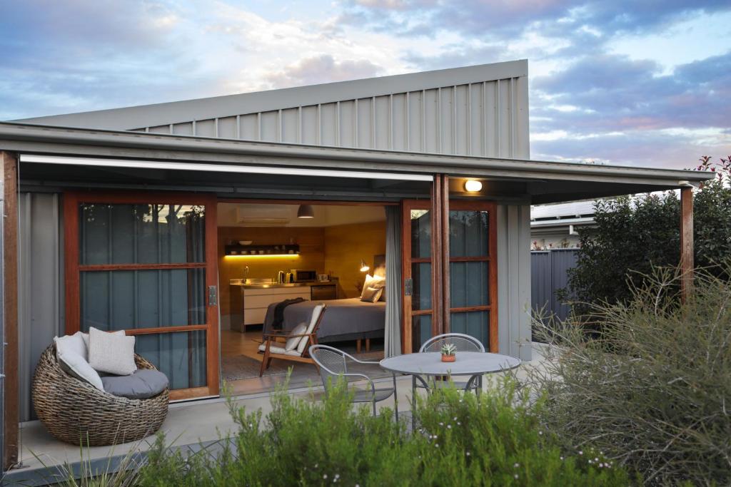 a glass extension of a house with a patio at Studio 367 in Tamworth