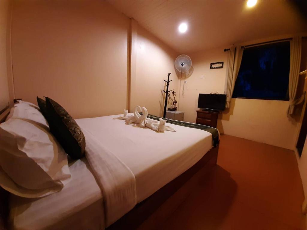 Ein Bett oder Betten in einem Zimmer der Unterkunft Panvaree Resort