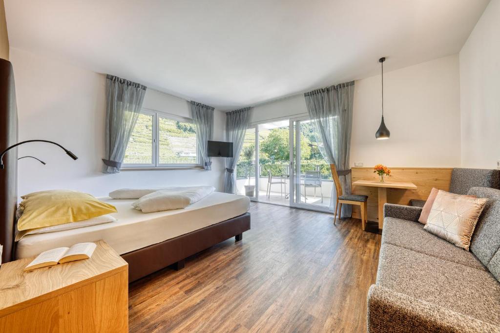 Postel nebo postele na pokoji v ubytování Das Mitterplarser Hotel