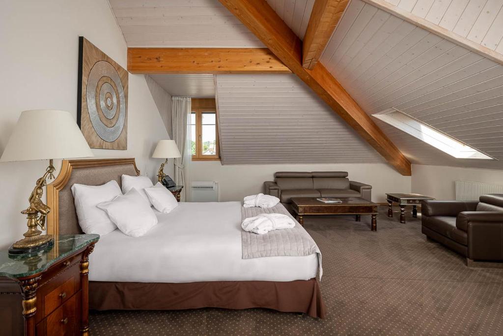 Postel nebo postele na pokoji v ubytování Hotel Le Rive