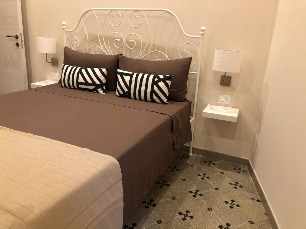 Postel nebo postele na pokoji v ubytování B&B Meliora Rooms