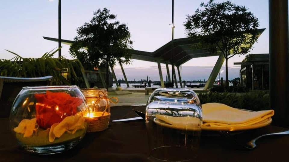 a table with two glass containers on a table at Hotel Belvedere in Venice-Lido
