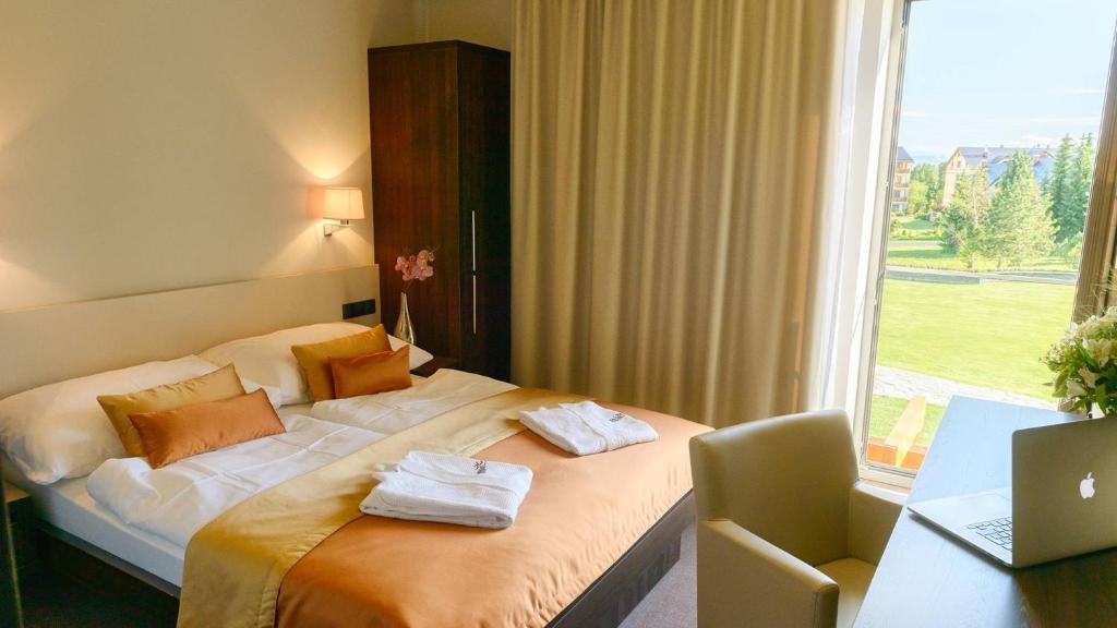 Postel nebo postele na pokoji v ubytování Horizont Resort