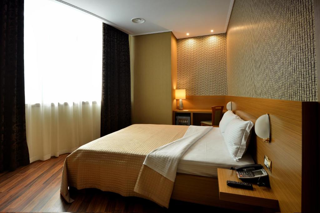 Postel nebo postele na pokoji v ubytování Hotel Austria