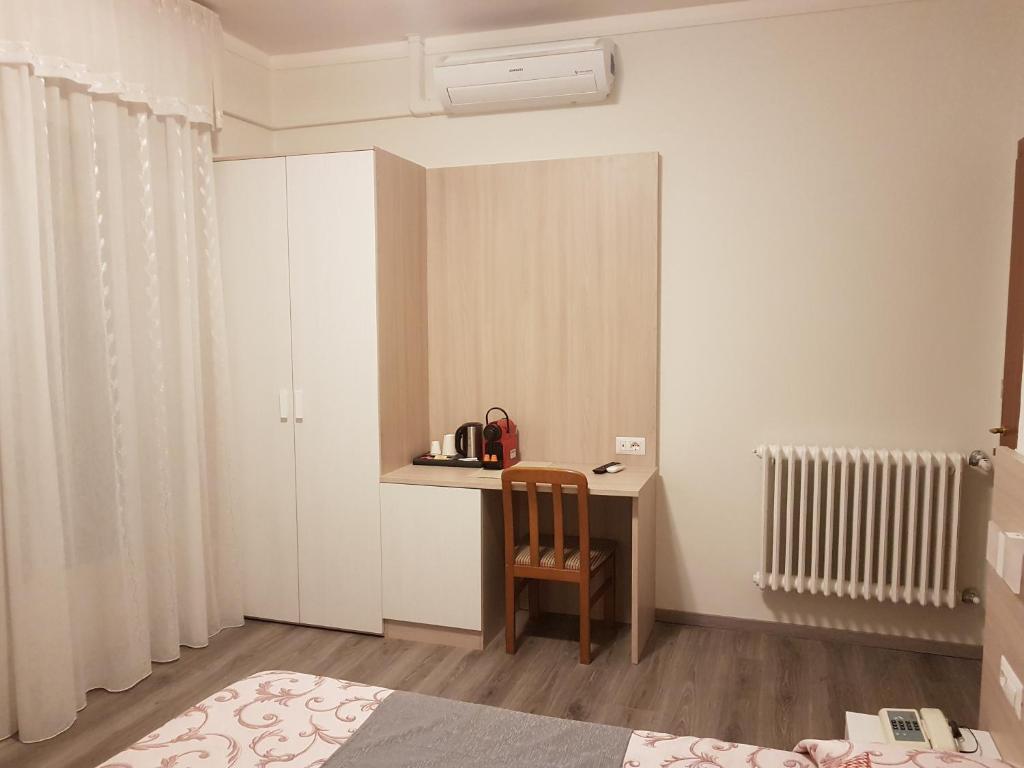 Postel nebo postele na pokoji v ubytování Albergo Paradiso
