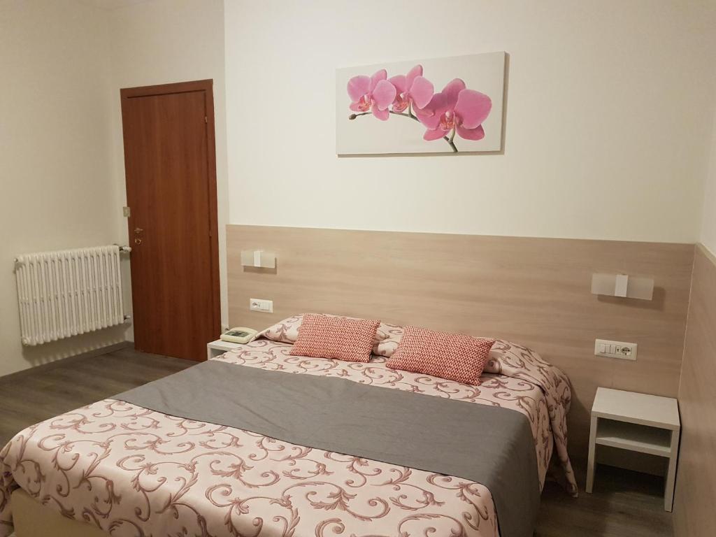 Postel nebo postele na pokoji v ubytování Albergo Paradiso