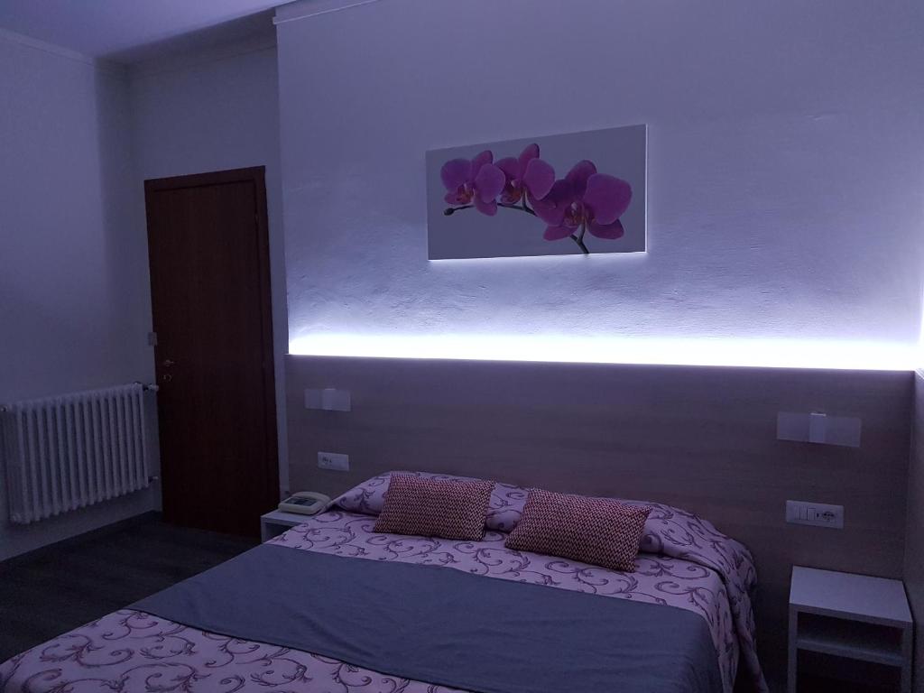 Postel nebo postele na pokoji v ubytování Albergo Paradiso