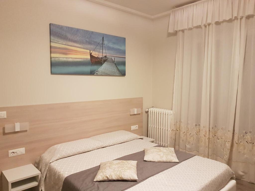 Postel nebo postele na pokoji v ubytování Albergo Paradiso