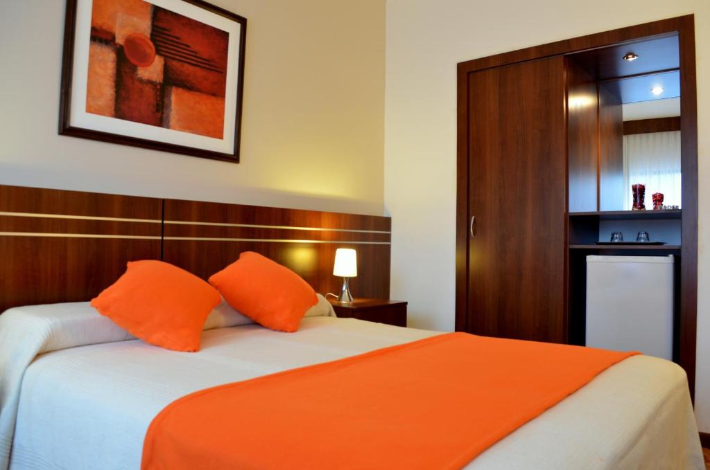 Postel nebo postele na pokoji v ubytování Hotel America