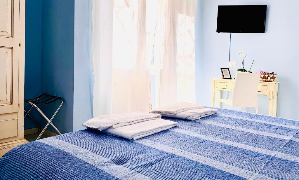Łóżko lub łóżka w pokoju w obiekcie Casa Italia