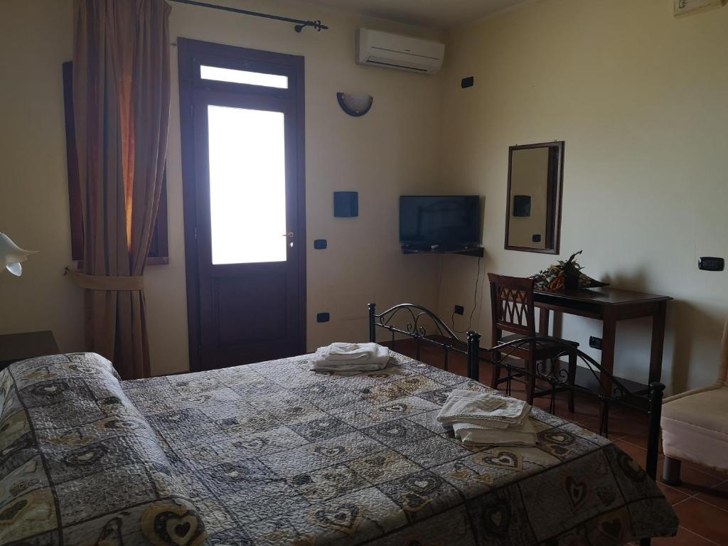 Łóżko lub łóżka w pokoju w obiekcie Agriturismo Catena