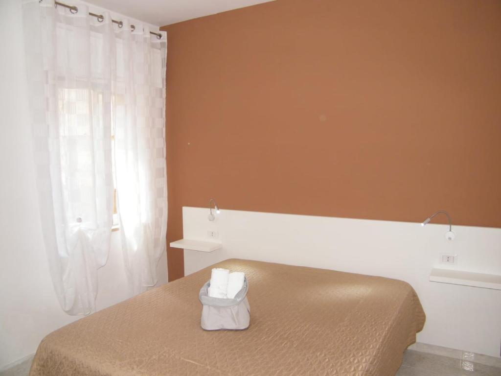 Łóżko lub łóżka w pokoju w obiekcie Casa Rachele ad Alcamo Marina