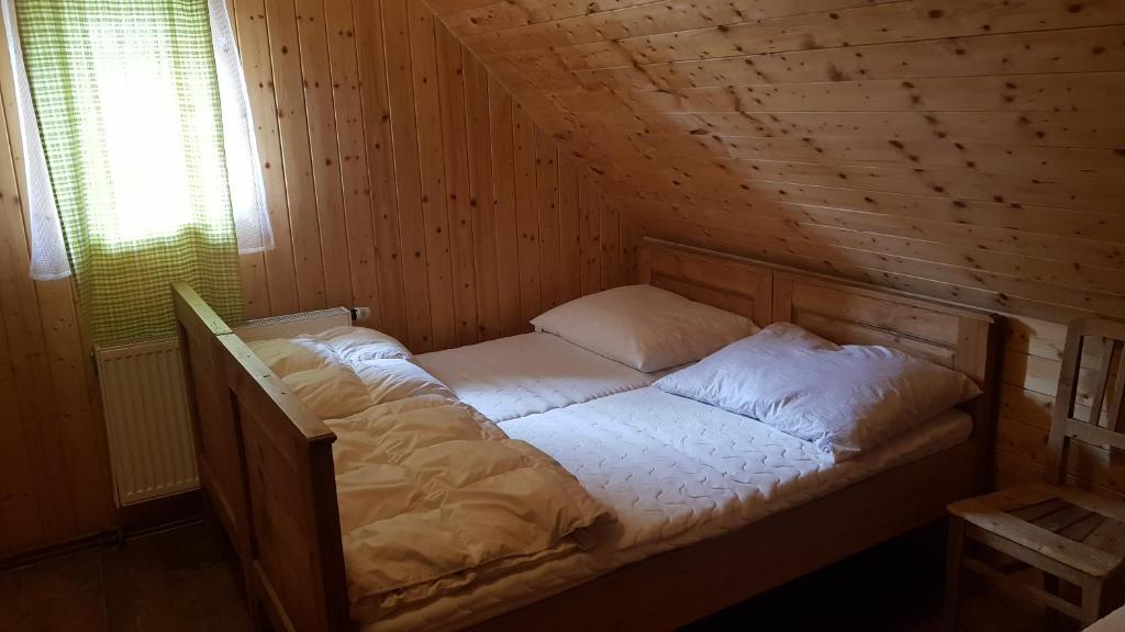Postel nebo postele na pokoji v ubytování Apartmány Chalupa u Floriánka