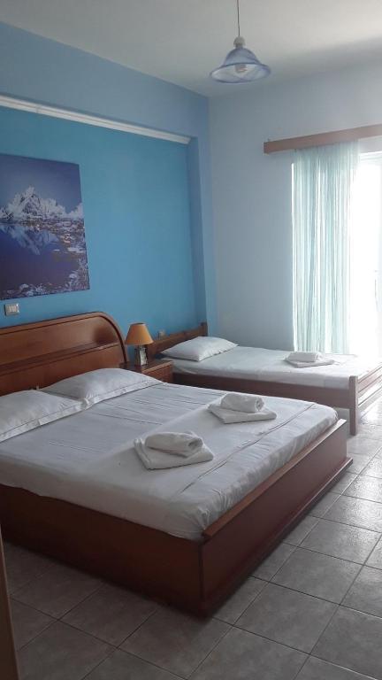 Postel nebo postele na pokoji v ubytování Hotel Odhisea Qeparo