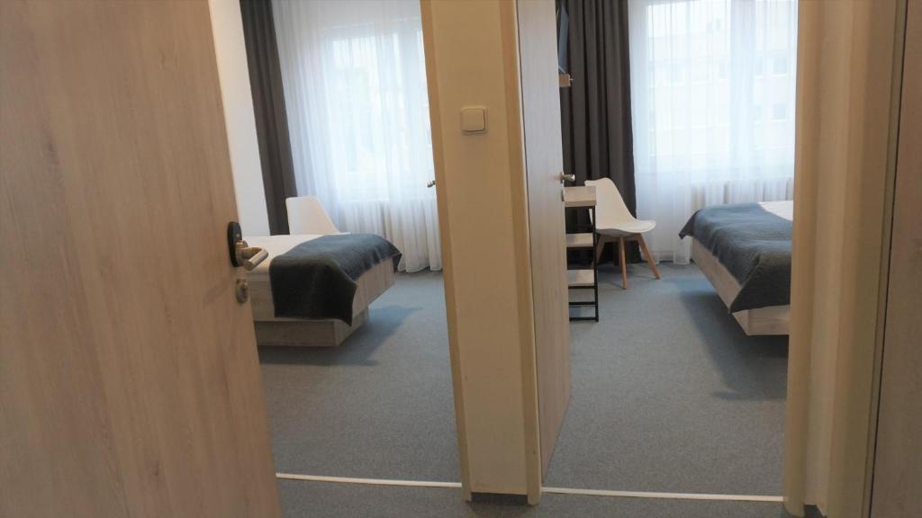 Postel nebo postele na pokoji v ubytování Hotel Metropol CB