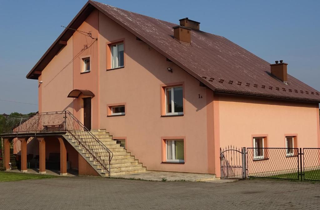 a large house with stairs on the side of it at Wynajem Pokoi dla Firm in Libiąż