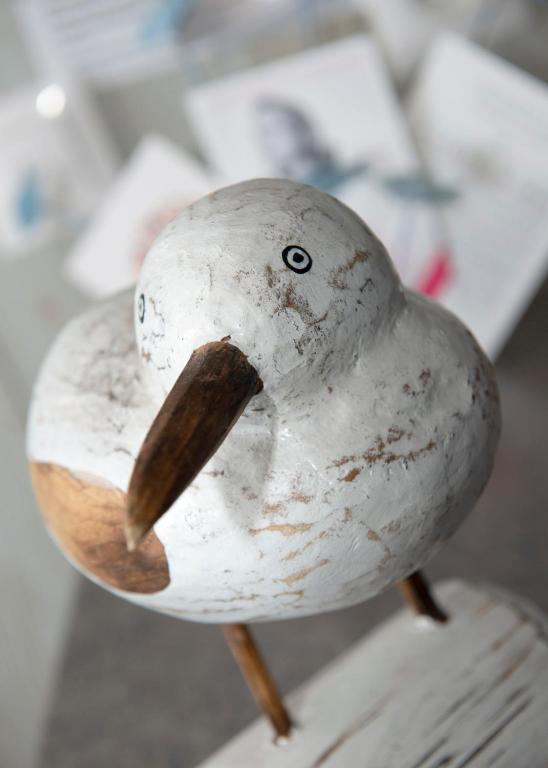 a white bird head with a wooden beak at La Vigie sur le Port in Granville