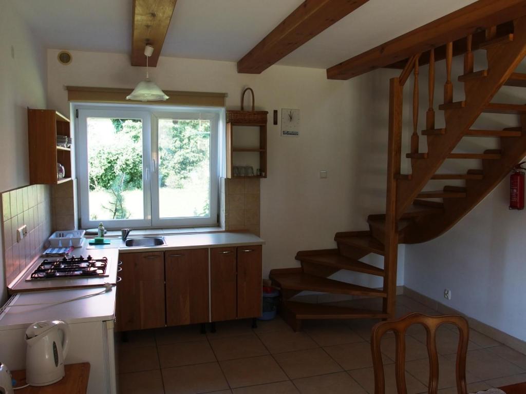 Kuchyň nebo kuchyňský kout v ubytování Siedlisko nad Rosiem