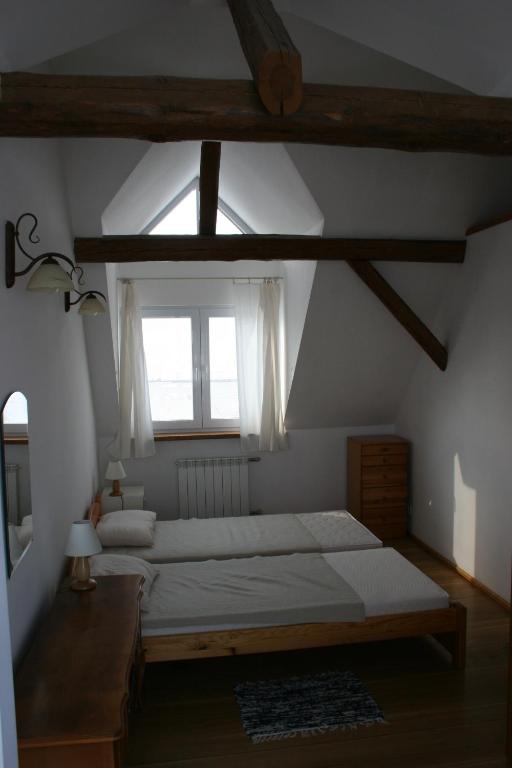 Postel nebo postele na pokoji v ubytování Siedlisko nad Rosiem