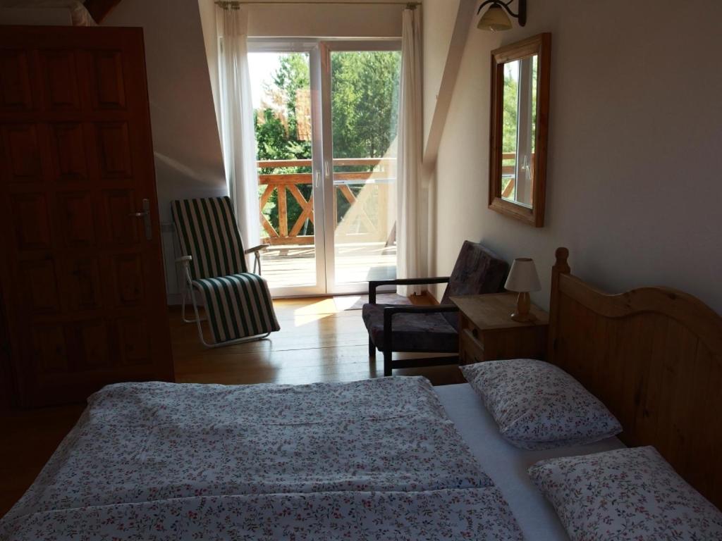 Postel nebo postele na pokoji v ubytování Siedlisko nad Rosiem