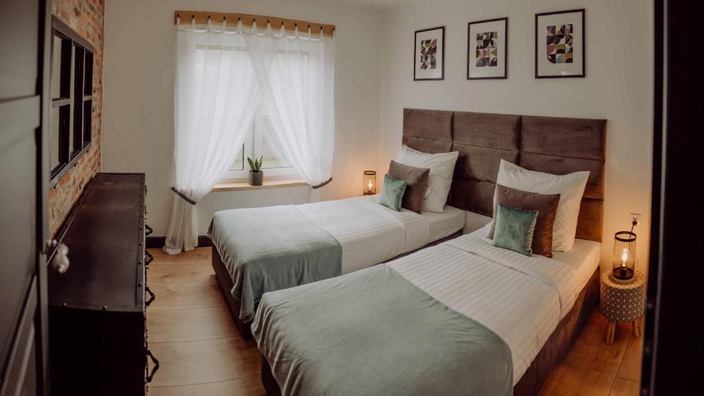 Un pat sau paturi într-o cameră la apartament BB