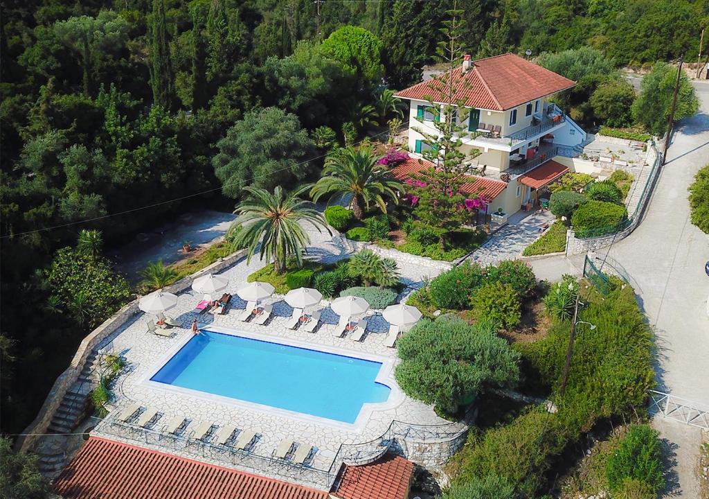 an aerial view of a house with a swimming pool at Panorama Apartments Fiscardo in Fiskardho