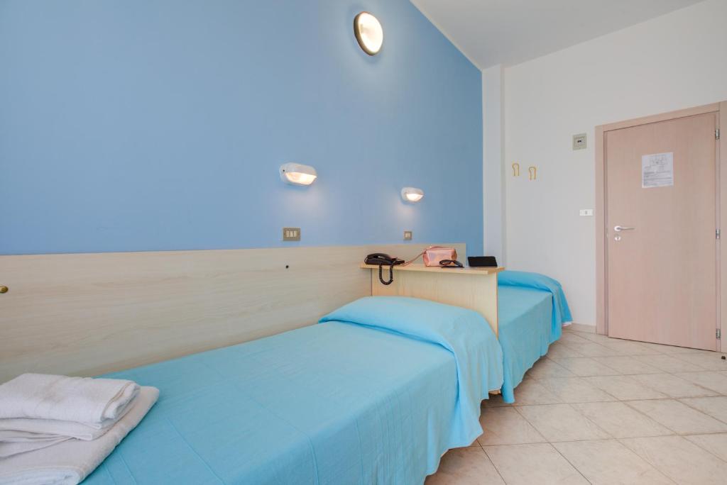 Postel nebo postele na pokoji v ubytování Hotel Sant'Angelo