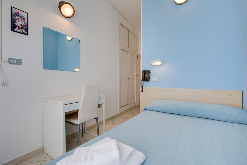 Postel nebo postele na pokoji v ubytování Hotel Sant'Angelo