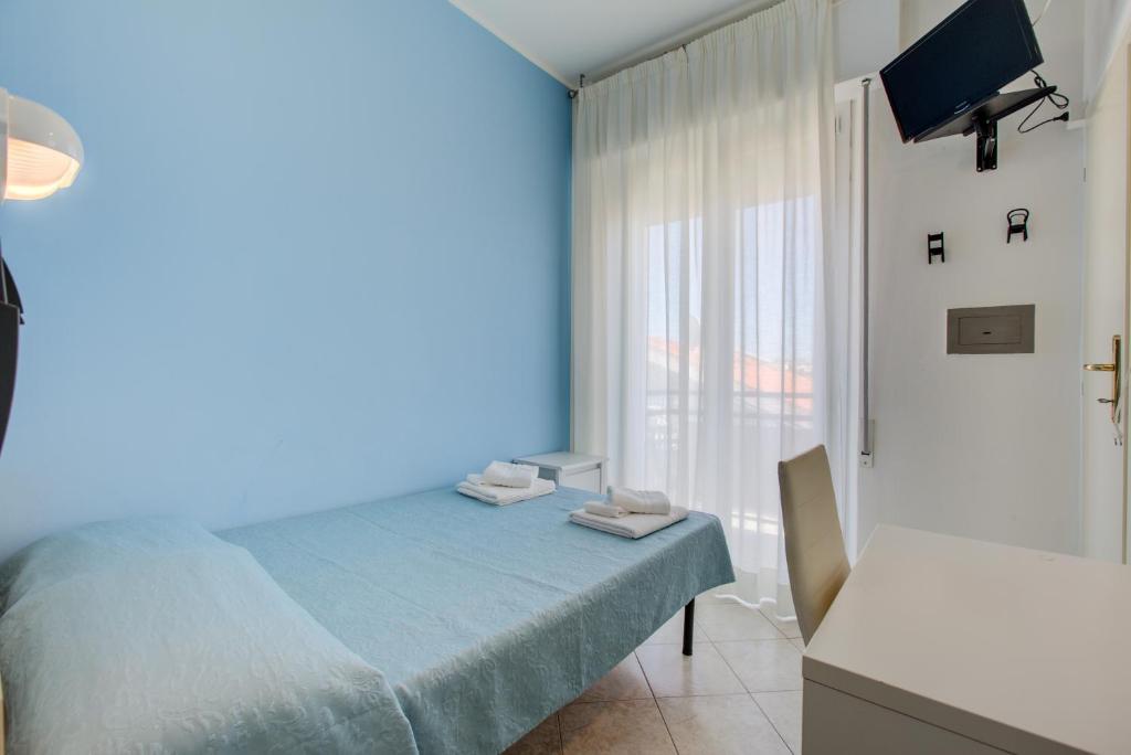Postel nebo postele na pokoji v ubytování Hotel Sant'Angelo
