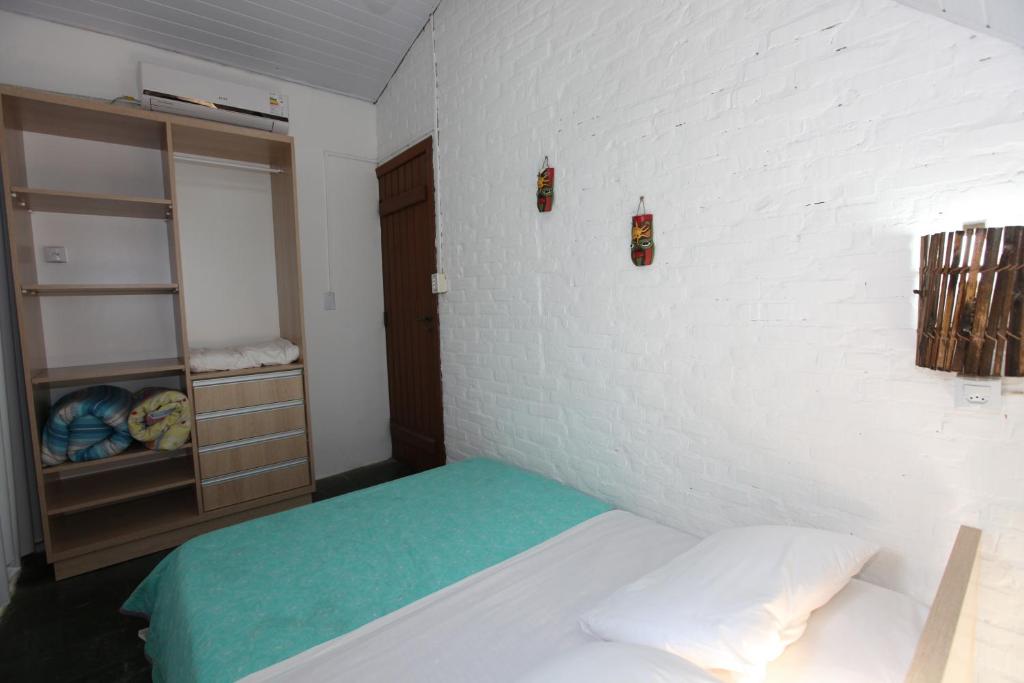 Cama ou camas em um quarto em Pousada Hibisco