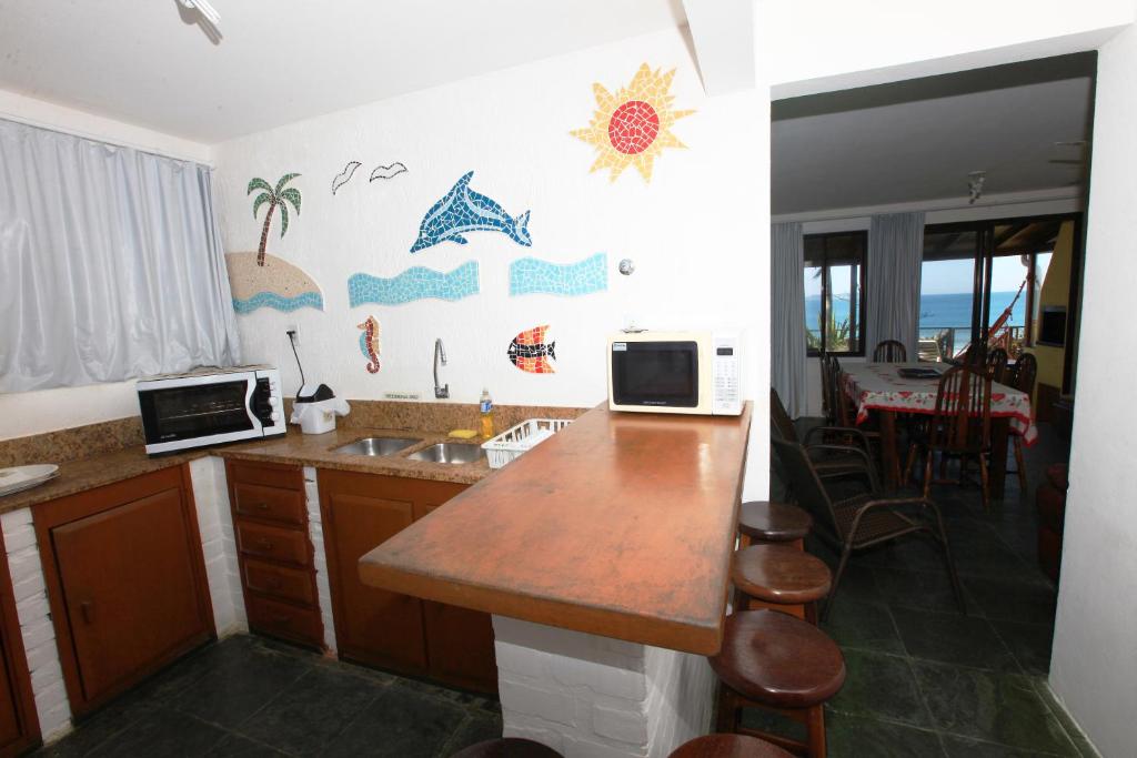 A cozinha ou cozinha compacta de Pousada Hibisco