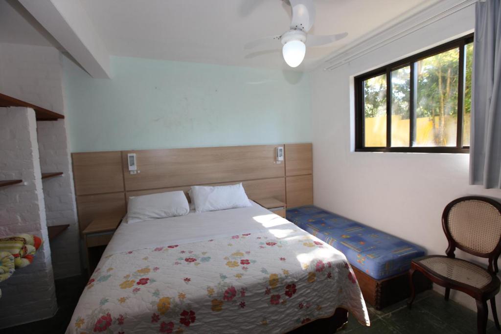 Cama ou camas em um quarto em Pousada Hibisco
