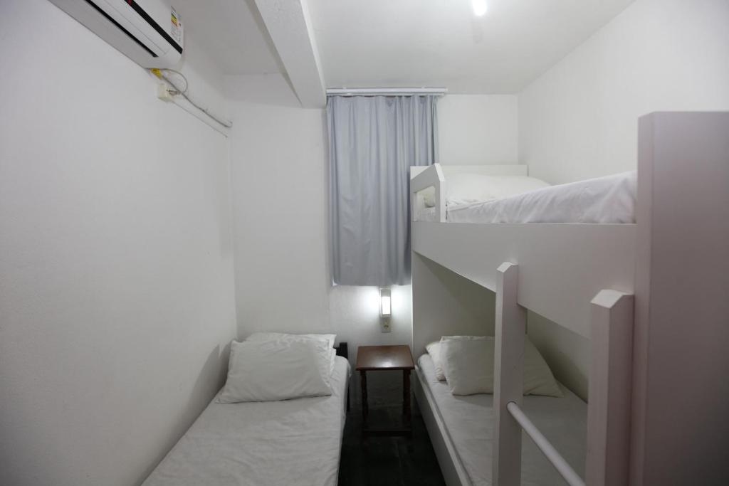 Cama ou camas em um quarto em Pousada Hibisco