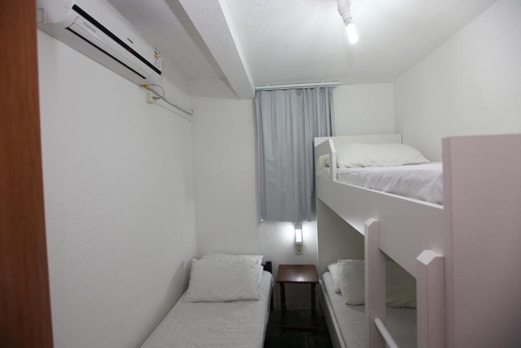 Cama ou camas em um quarto em Pousada Hibisco