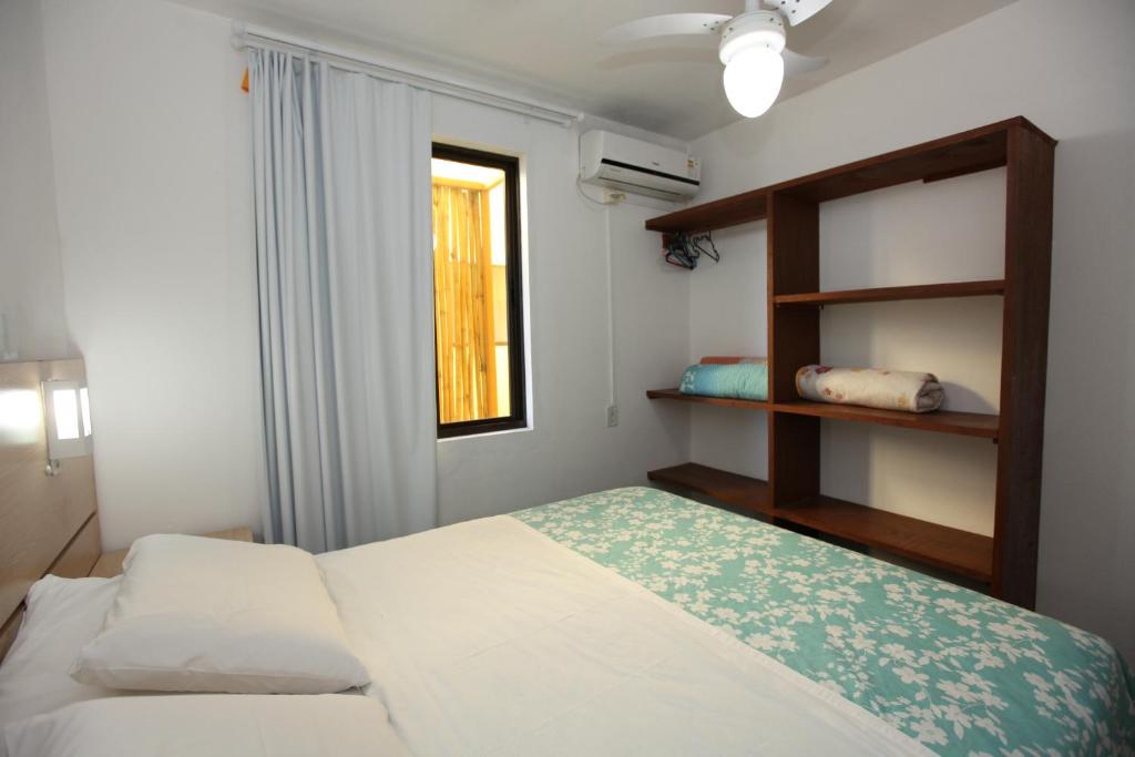 Cama ou camas em um quarto em Pousada Hibisco