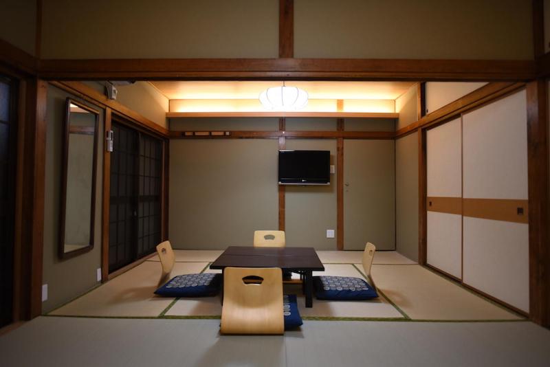 Postel nebo postele na pokoji v ubytování Ryokan Sansuiso