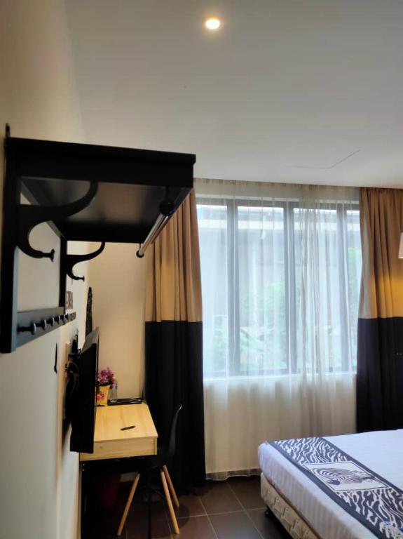 Postel nebo postele na pokoji v ubytování 9 Square Hotel - Subang