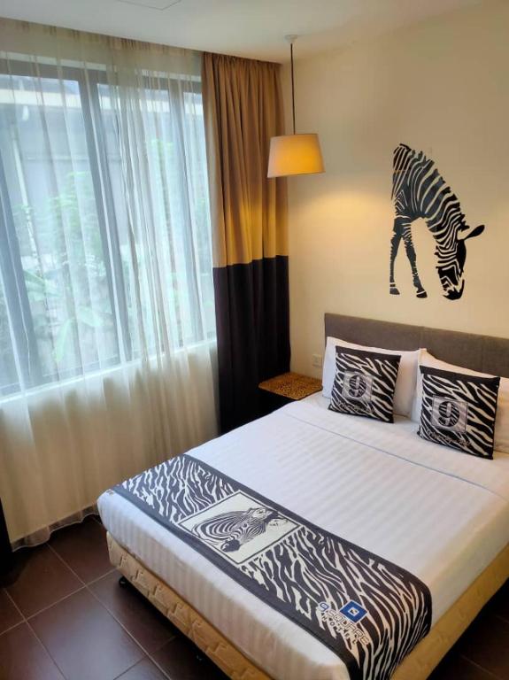 Postel nebo postele na pokoji v ubytování 9 Square Hotel - Subang